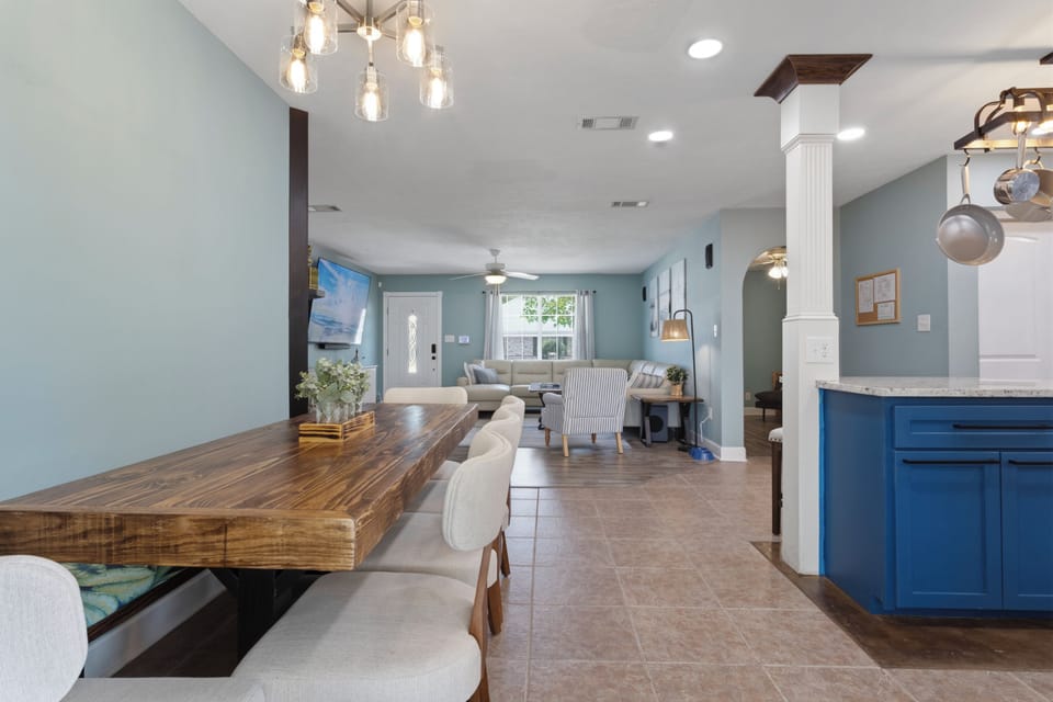 Dining table with bench provides seating for 8+