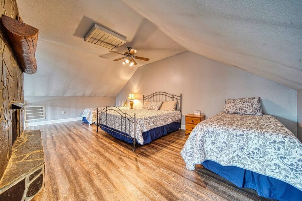 King bed and two twins in the loft with a private fireplace