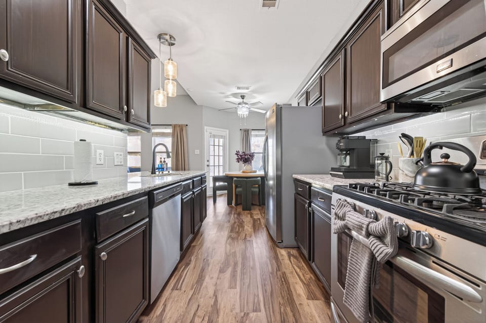 Modern kitchen with sleek finishes and stainless steel appliances.