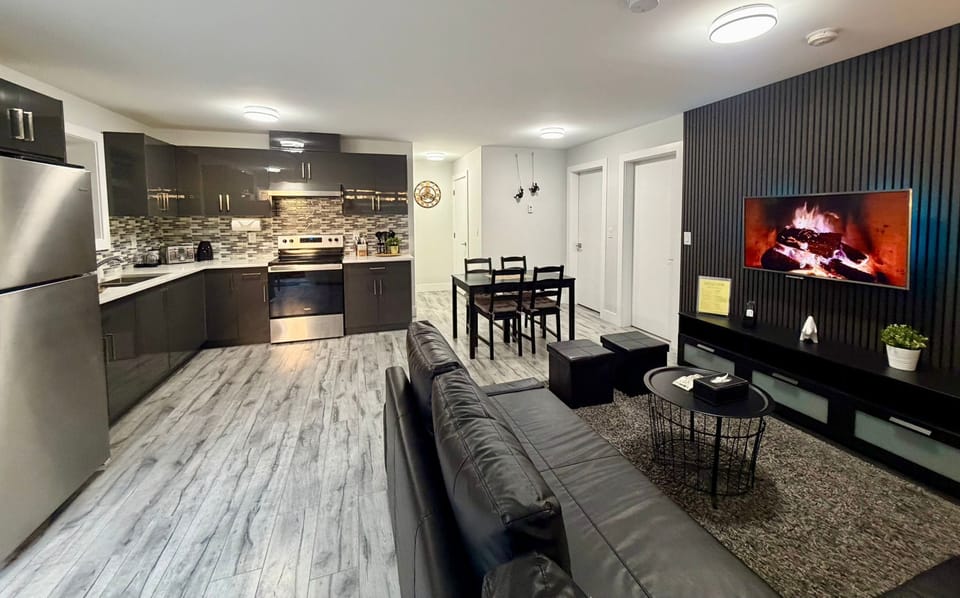 Living room with super comfortable leather sofa bed, LG Television with over 2000 channels. 