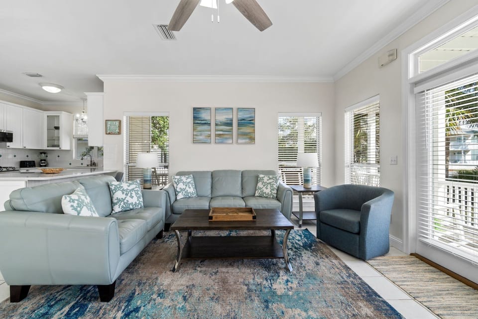 Cozy up in this bright and inviting living room with a fireplace, perfect for relaxation.