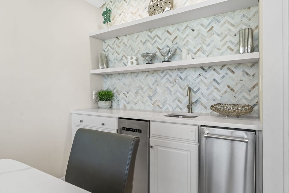 Make yourself at home with a wine fridge & ice maker at the convenient wet bar.