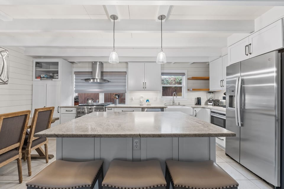 Open layout allows the cooks to be a part of the action in the living/dining space too.