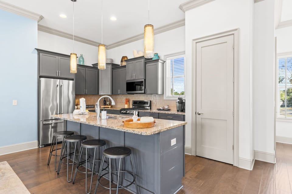 Cook, dine, and relax together in this open-concept kitchen that flows seamlessly into the living area.