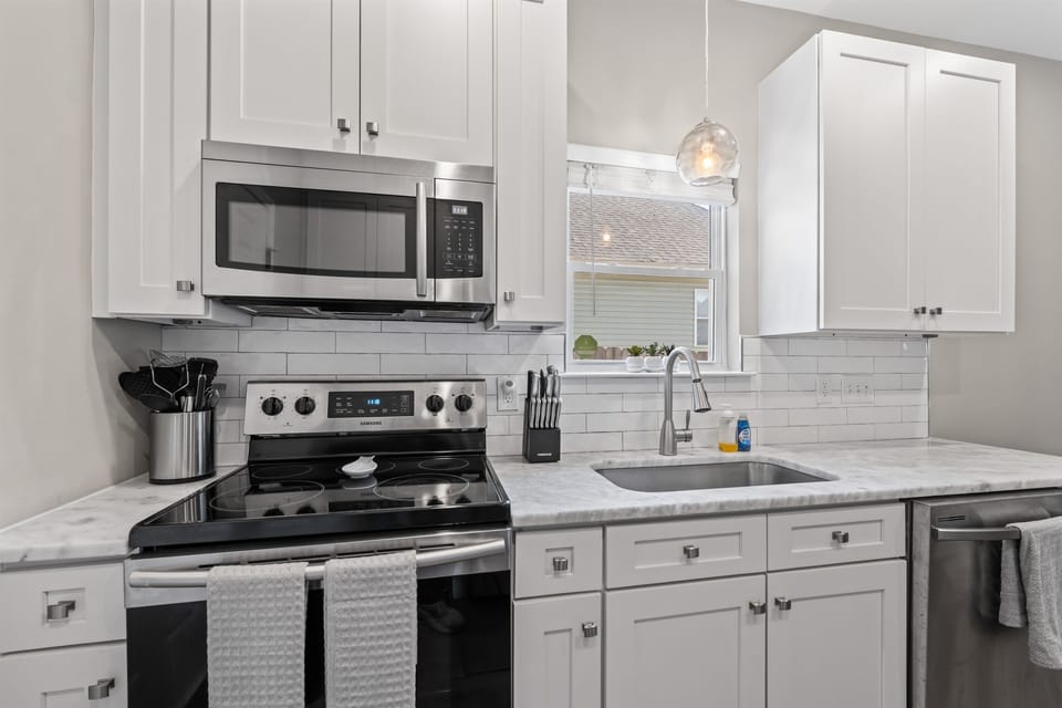 Fully equipped modern kitchen with stainless steel appliances