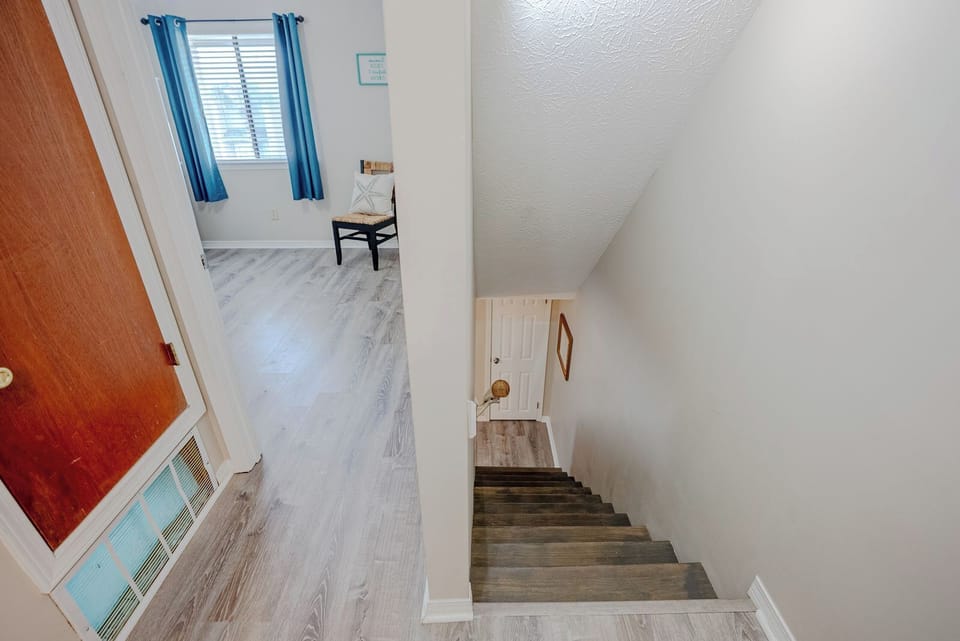 Staircase leading to both bedrooms.