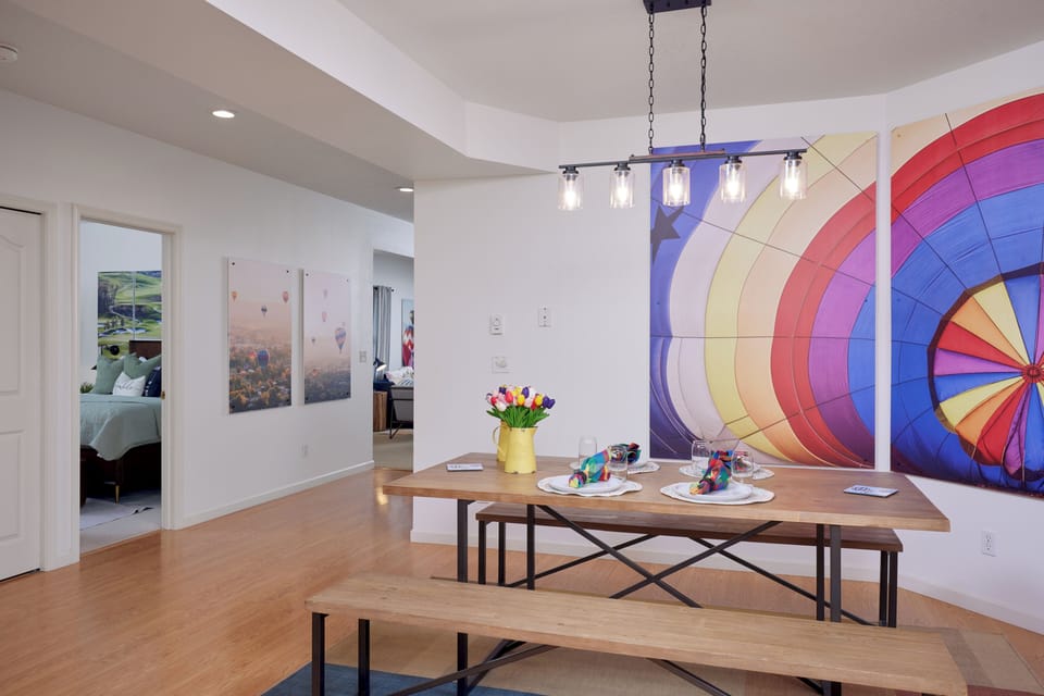 Bright dining space with bold art, bench seating, and a modern open feel