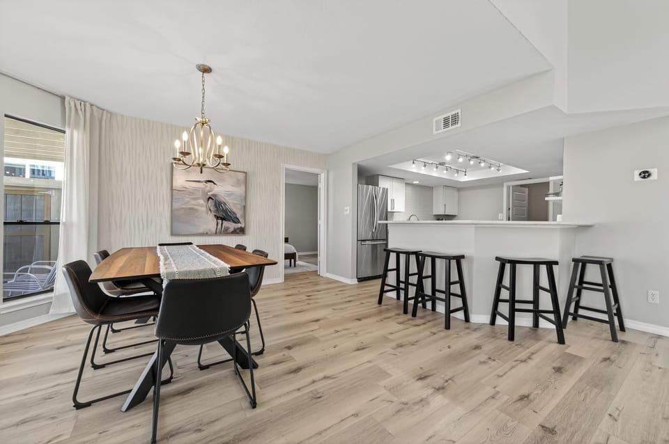 Open layout connects the living area seamlessly to the kitchen and dining space.