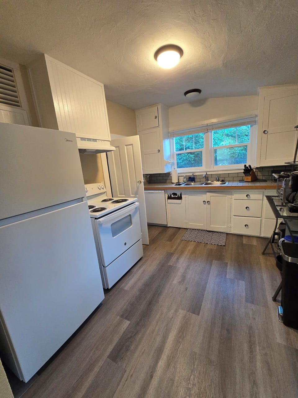 The bright kitchen has full size appliances to make meal preparation a pleasure