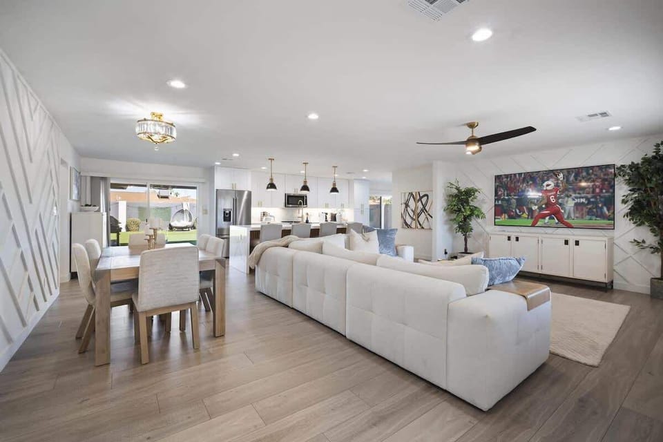 Bright and open living area featuring a smart TV and cozy furnishings.