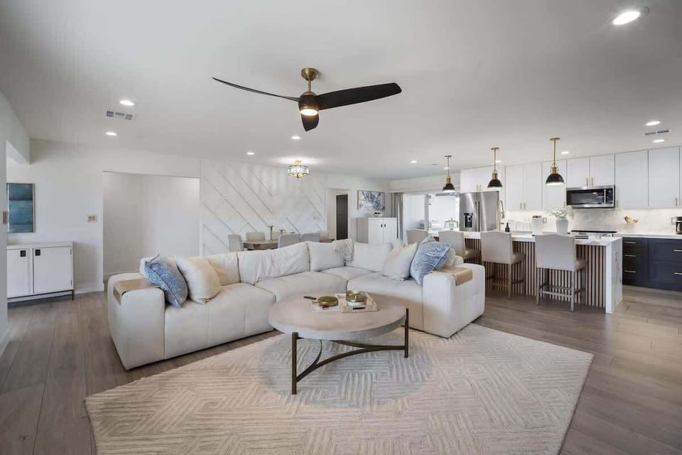 Bright and open living area featuring a smart TV and cozy furnishings.
