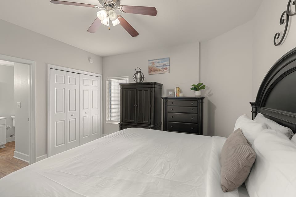Bedroom 3 features a king bed, a TV and an ensuite bathroom.