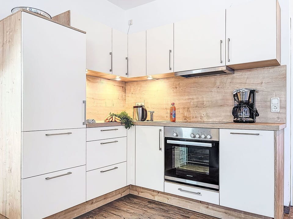 Cabinetry, Kitchen, Kitchen Appliance, Countertop, Flooring, Furniture, Major Appliance, Wood, Interior Design, Floor