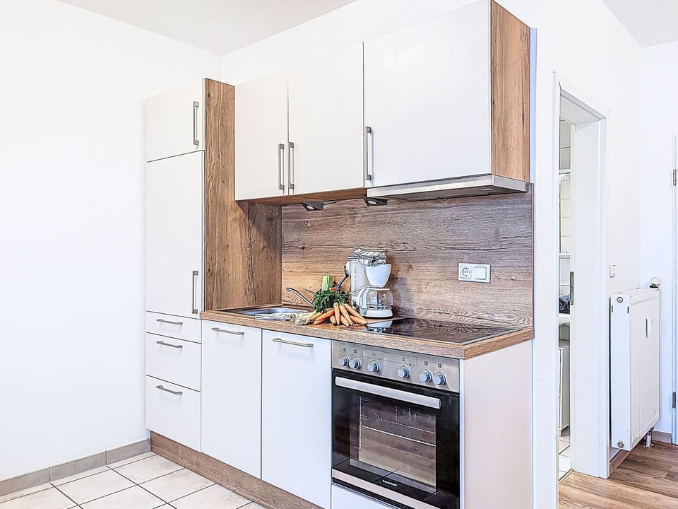 Kitchen, Countertop, Cabinetry, Kitchen Appliance, Flooring, Major Appliance, Interior Design, Wood, Furniture, Floor