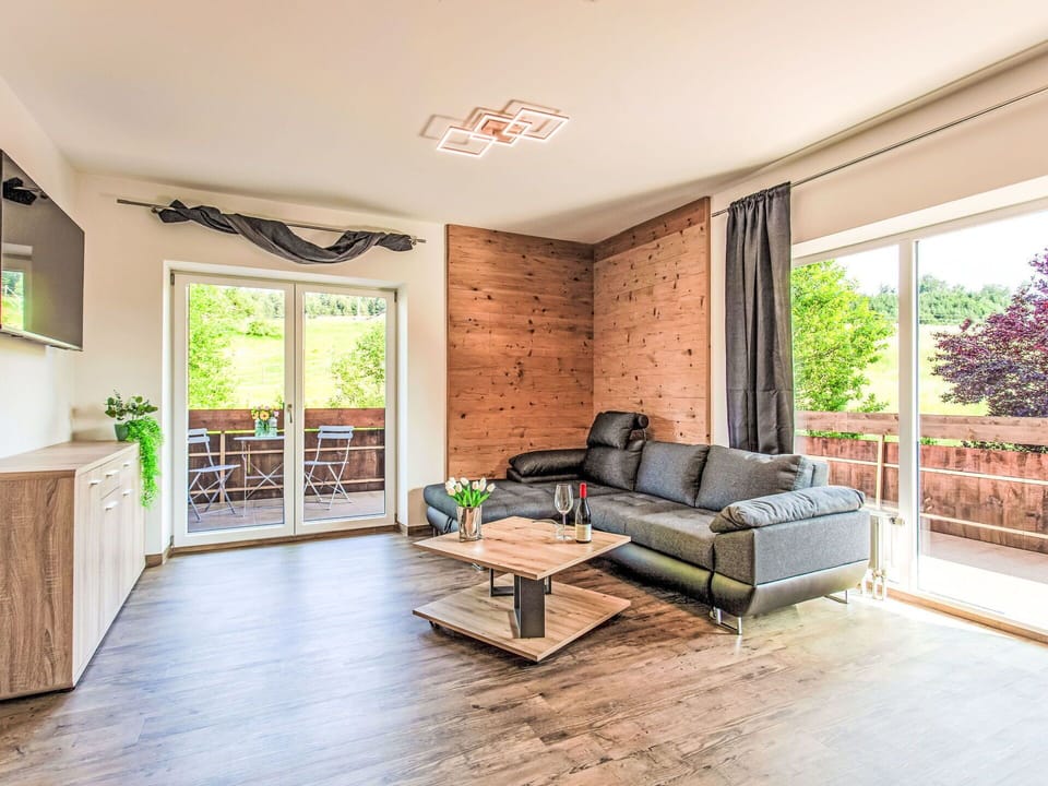 Furniture, Wood, Interior Design, Flooring, Wood Flooring, Floor, Couch, Living Room, Room, Home