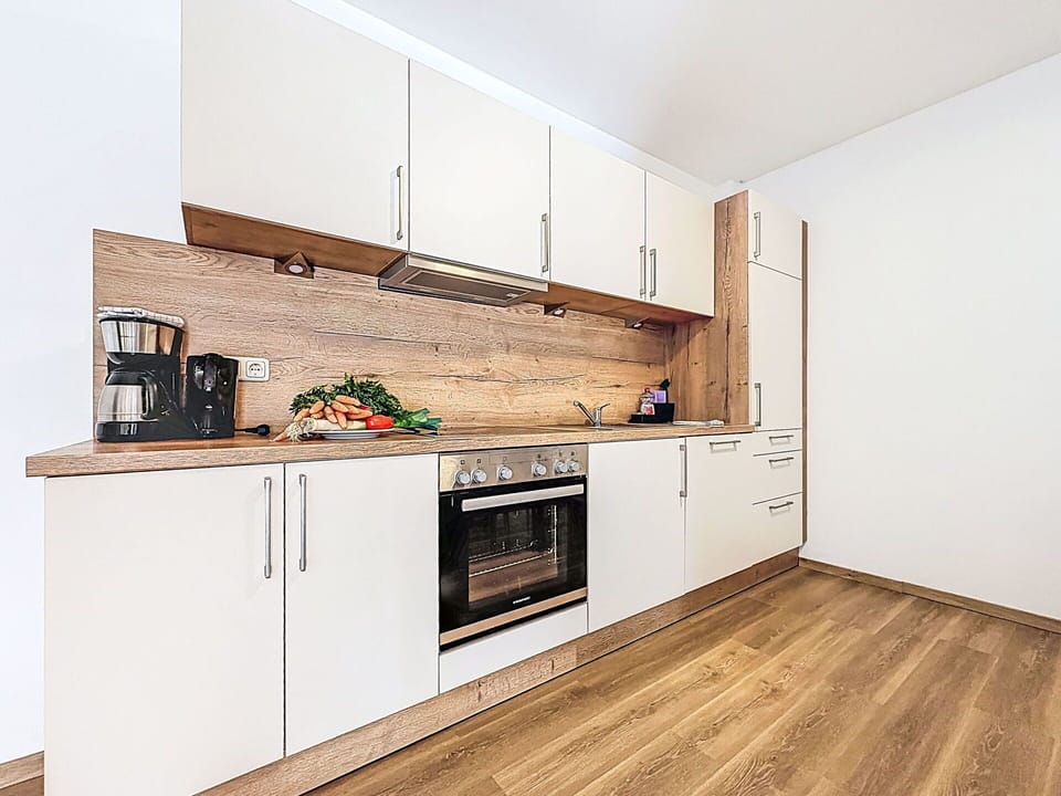 Flooring, Wood Flooring, Floor, Wood, Interior Design, Countertop, Cabinetry, Laminate Flooring, Kitchen, Furniture