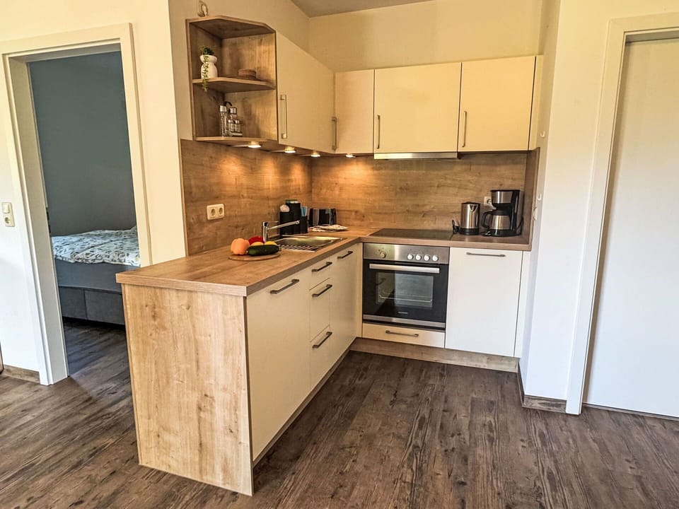 Flooring, Cabinetry, Furniture, Countertop, Floor, Wood, Major Appliance, Interior Design, Kitchen Appliance, Kitchen