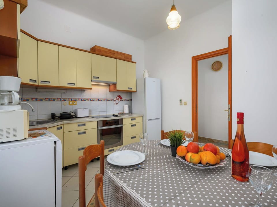 Interior Design, Furniture, Flooring, Kitchen Appliance, Floor, Kitchen, Countertop, Room, Major Appliance, Ceiling