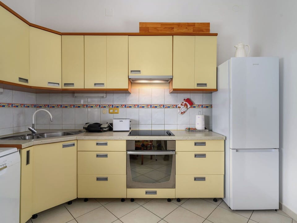 Kitchen, Kitchen Appliance, Cabinetry, Major Appliance, Furniture, Countertop, Wood, Flooring, Interior Design, Kitchen Stove
