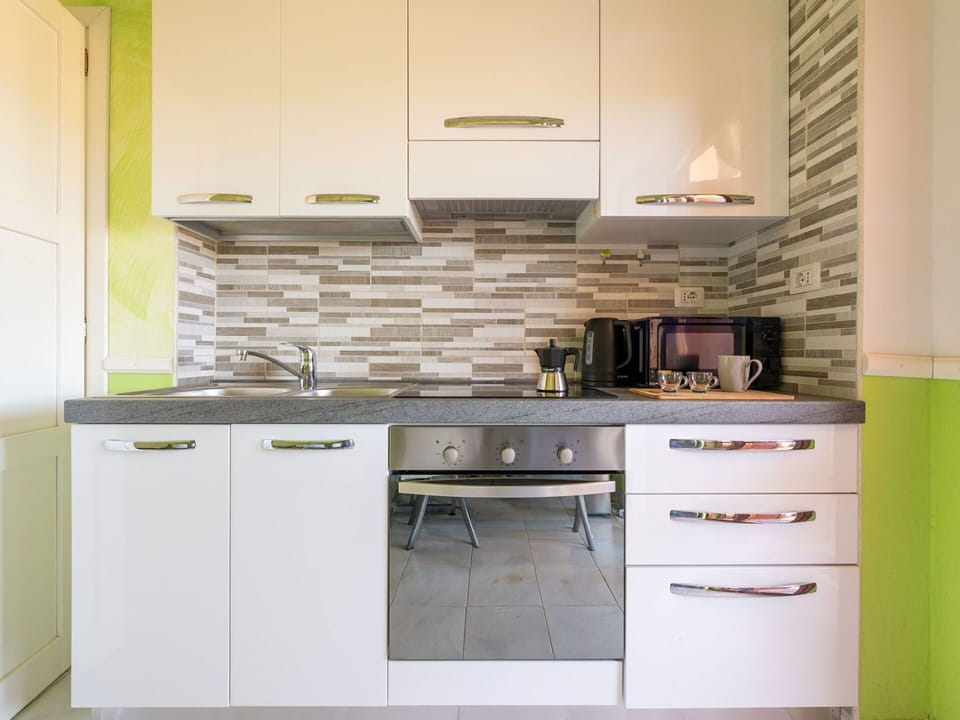 Kitchen, Countertop, Cabinetry, Flooring, Interior Design, Wood, Kitchen Appliance, Furniture, Floor, Major Appliance