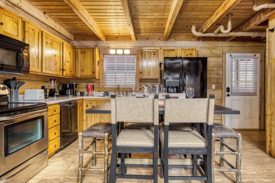 Gatlinburg Vacation Rental "Ole Red" - Dining area and fully furnished kitchen 