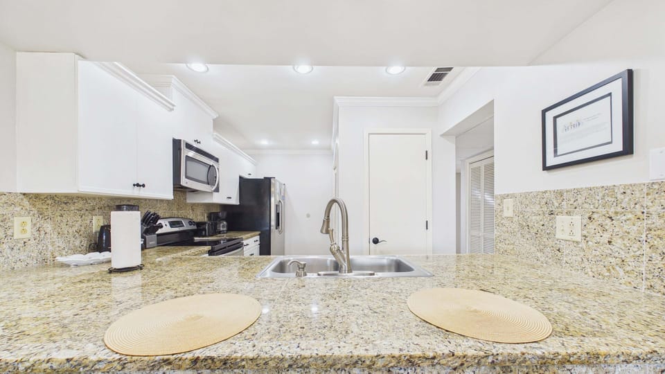 Breakfast bar on kitchen counter with high chair seating