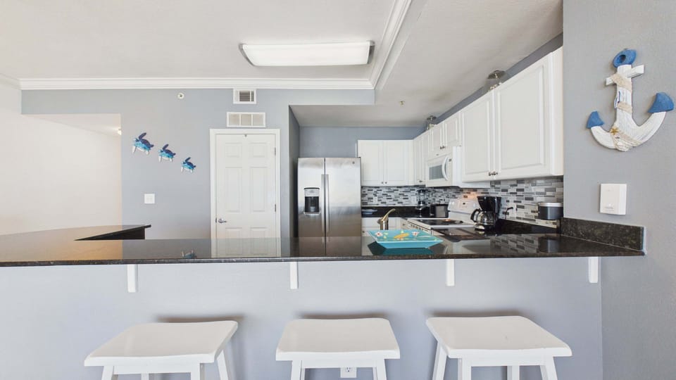 Kitchen has breakfast bar seating