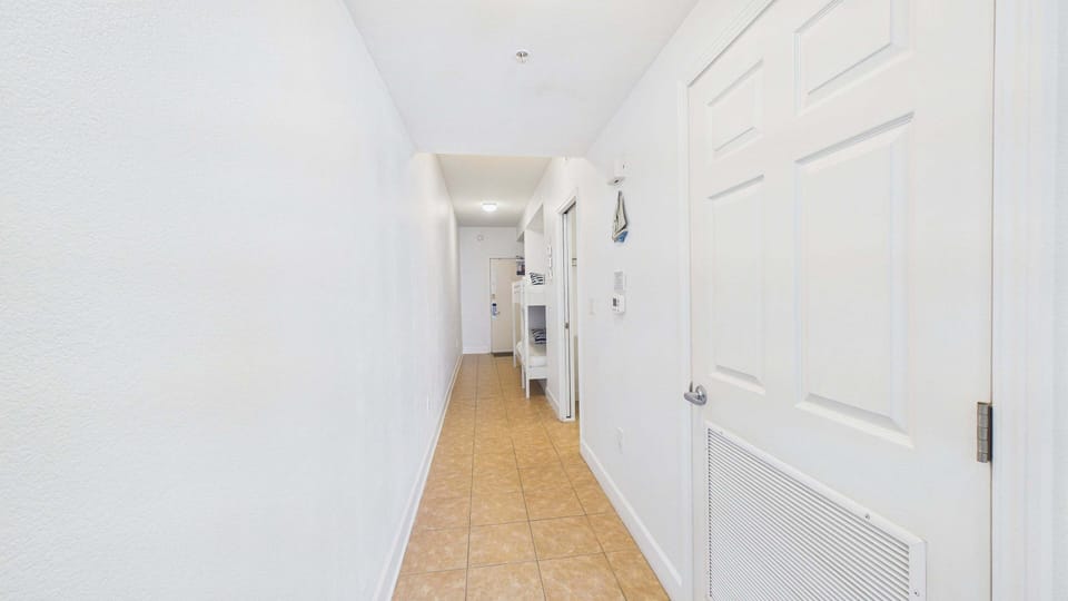 Hallway to bedroom and sleeping arrangements
