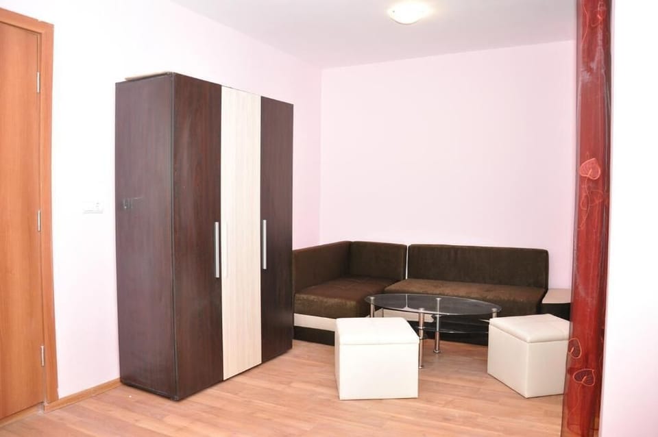 Family Suite, Balcony, Courtyard View | Living area | 50-inch LED TV with cable channels