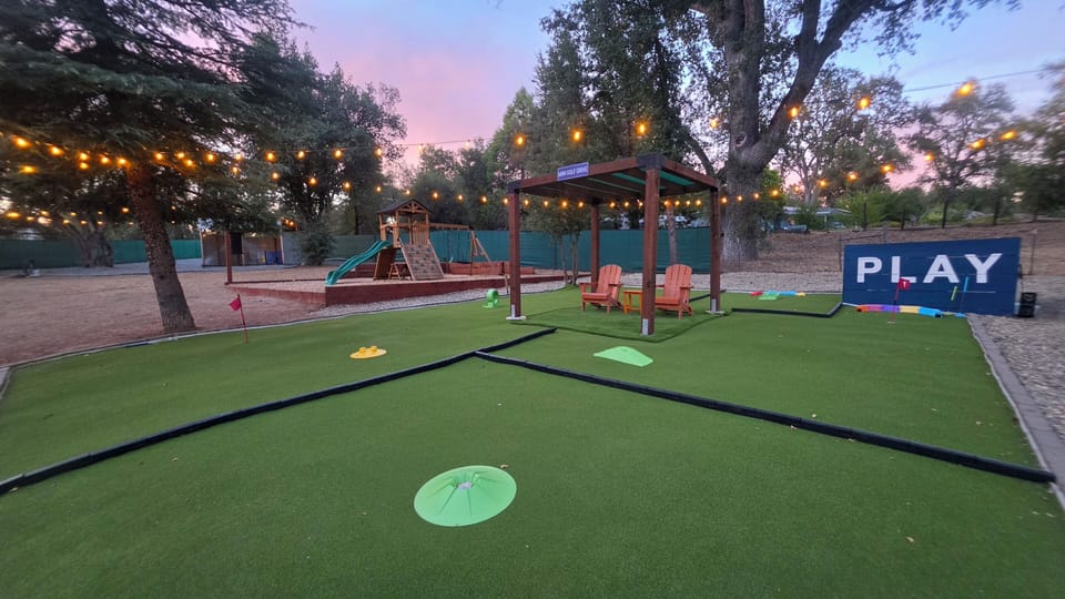 Mini golf stations in the backyard of the property