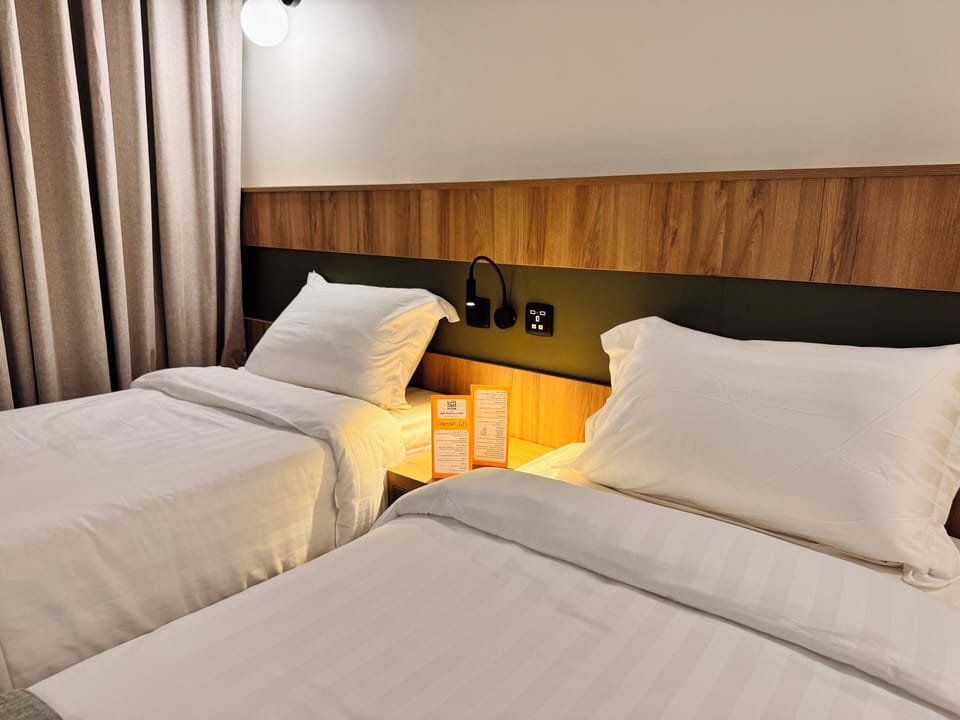 Twin Room, City View | In-room safe, desk, blackout drapes, iron/ironing board