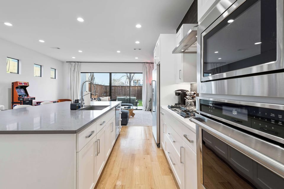 Cooking for the group is easy in this spacious kitchen with sleek appliances, generous counter space, and plenty of room to prep.