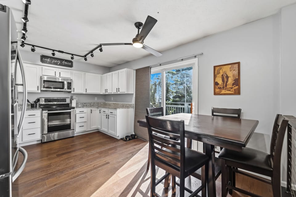 Bright kitchen and dining area with deck access and natural light