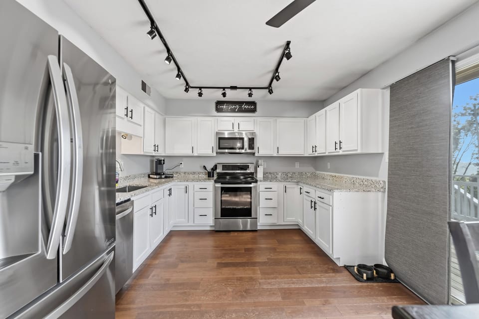 Bright modern kitchen with stainless steel appliances and ample counter space