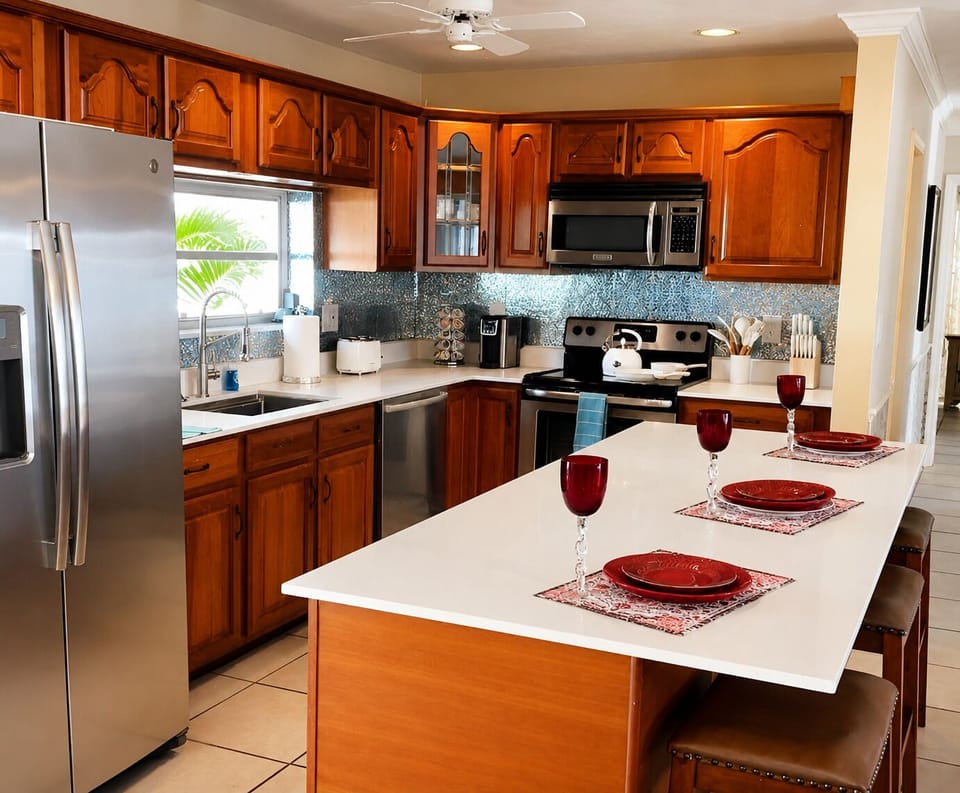 Kitchen, with stainless steel appliances, microwave, oven, stove, refrigerator, freezer, coffee maker and more....