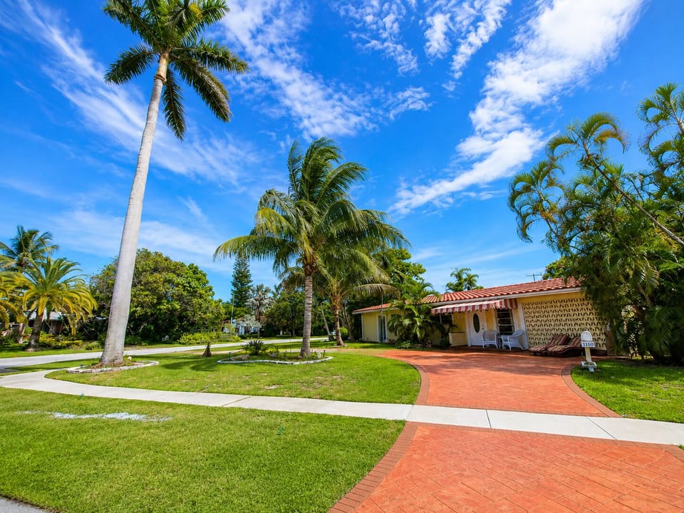 Tropical, outdoor, property grounds, property entrance.  Highest royal palm in Deerfield Beach.  