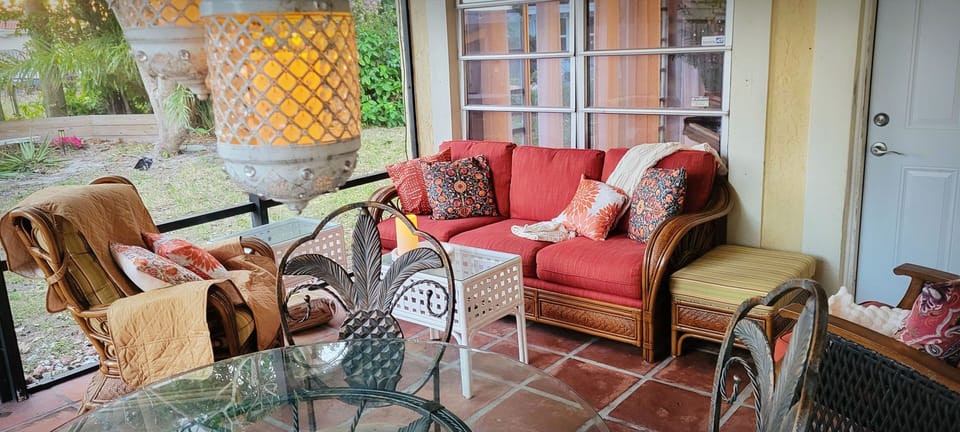 Tropical, couch, terrace patio, outdoor, daytime. 