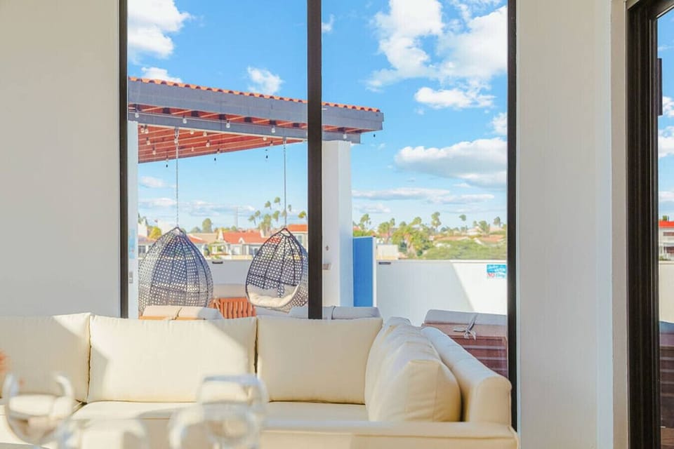 Seamless Indoor-Outdoor Living with Balcony Views, Cozy Seating, and Relaxing Lounge Area—Perfect for Breezy Tropical Moments