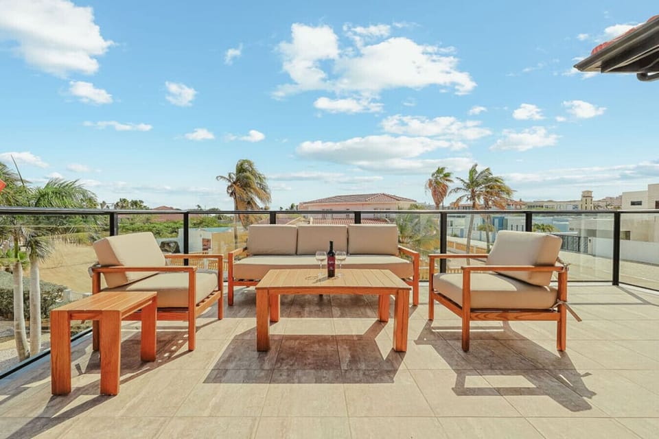Spacious Outdoor Terrace with Stylish Lounge Seating and Scenic Views—Ideal for Relaxing, Entertaining, and Soaking Up Island Breezes