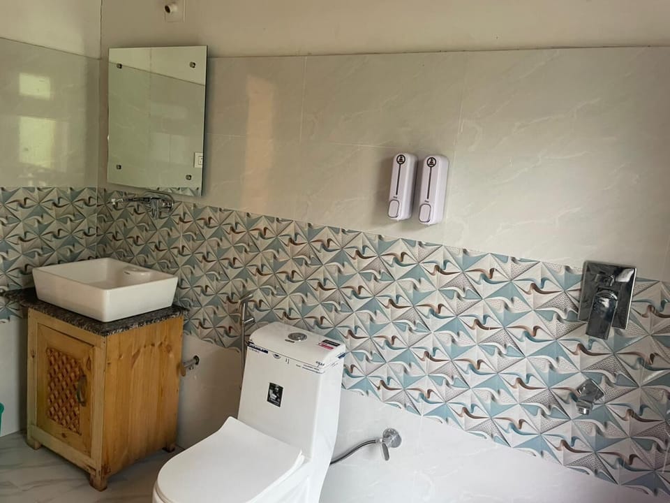 Deluxe Double Room, Hill View | Bathroom | Shower, slippers, towels, soap