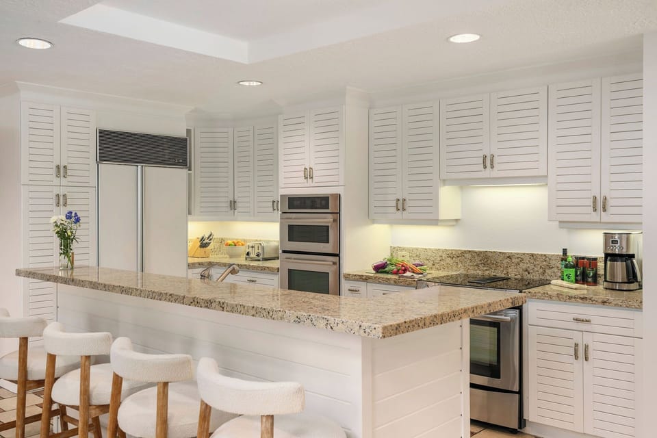 Gather around this bright, well-equipped kitchen where your group can share meals and make memories. Stainless steel appliances, ample counter space, and a welcoming breakfast bar invite you to cook, chat, and linger over morning coffee together.