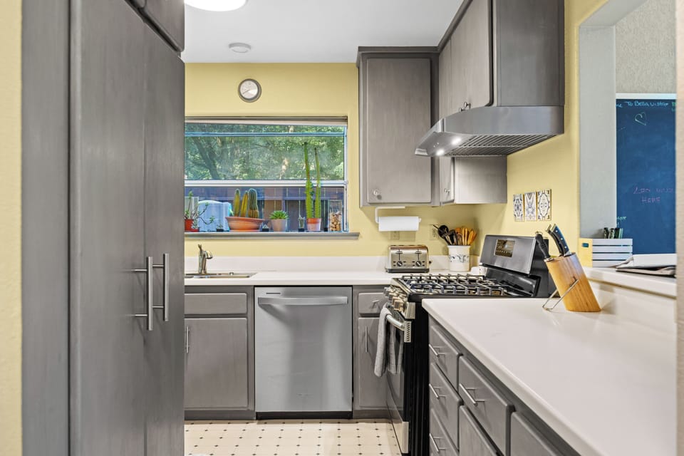 You'll love cooking at Bella Vista with stainless appliances, ample counters, and redwood views through the window.