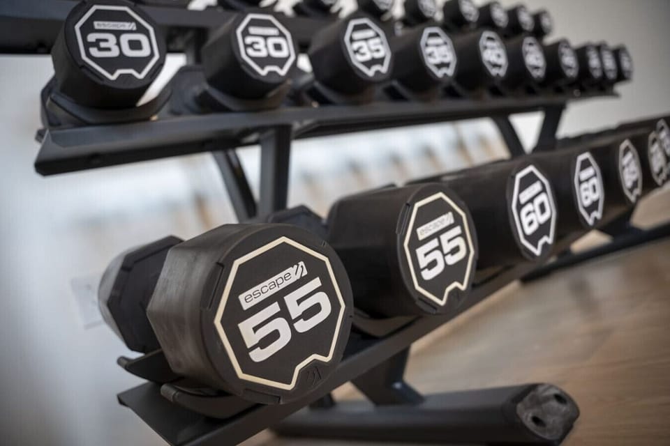 Free weights in the 24/7 modern gym.
