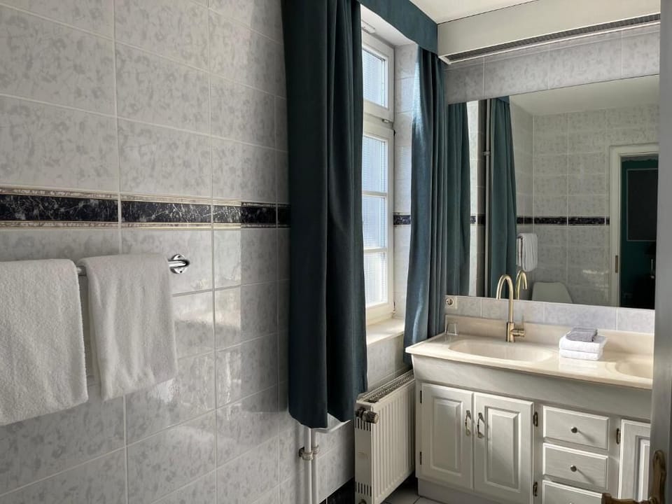 Bathtub, hair dryer, towels, soap