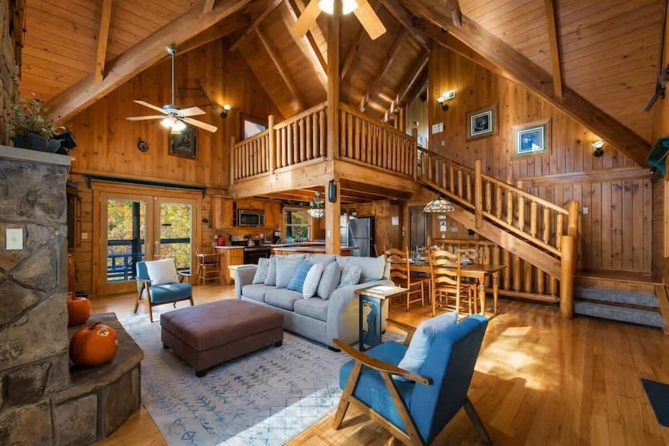 This living room offers open views and a welcoming layout—perfect for relaxing together and staying connected with family while cooking and gathering.