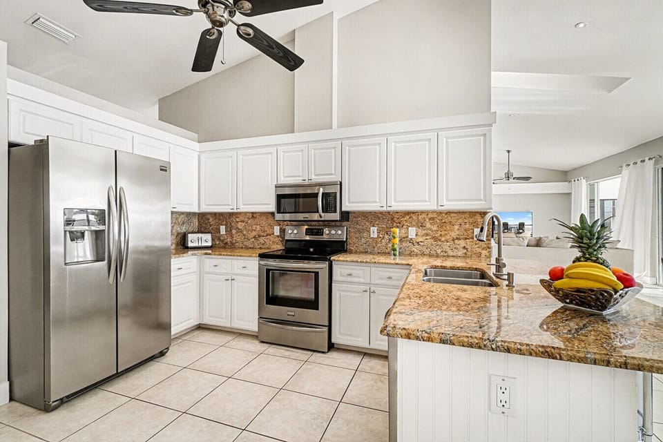 Well-appointed kitchen with premium finishes throughout. Stainless steel appliances, granite countertops, and generous prep space—perfect for cooking, hosting, and gathering with ease.