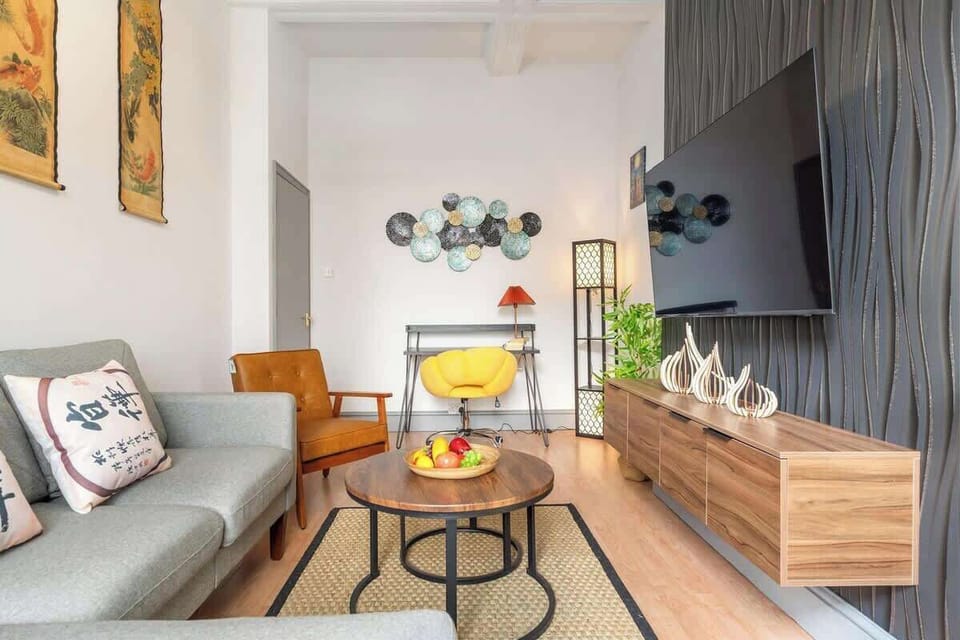 Open, airy living space with TV and stylish contemporary decor