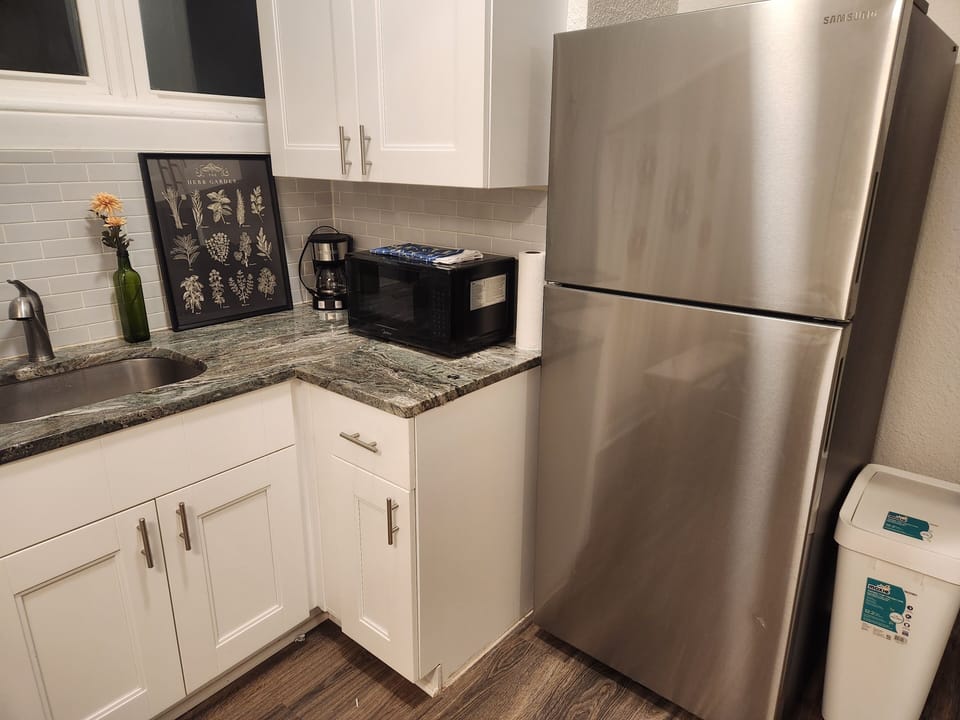 Kitchenette with full size refrigerator,  microwave, and coffee pot