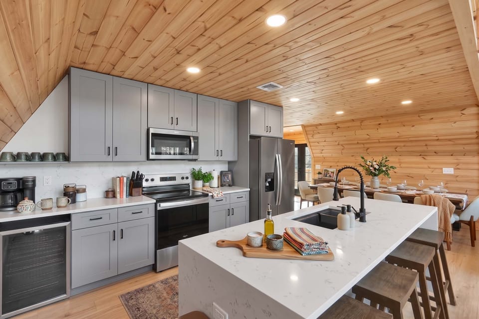 Modern Kitchen w/ Large Island & Stainless Steel Appliances