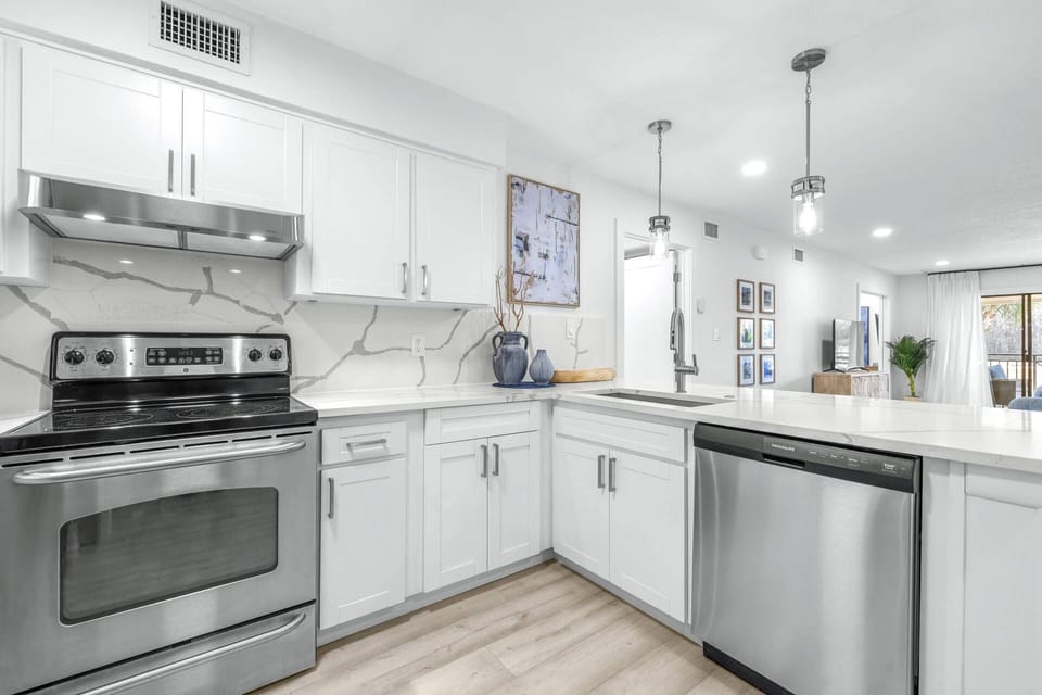 Open kitchen design connects effortlessly to the living space, creating a bright and welcoming atmosphere.